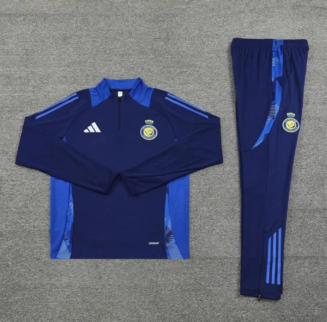 طقم رياضي أزرق بسحاب ربعي لنادي النصر لموسم 2024/2025
